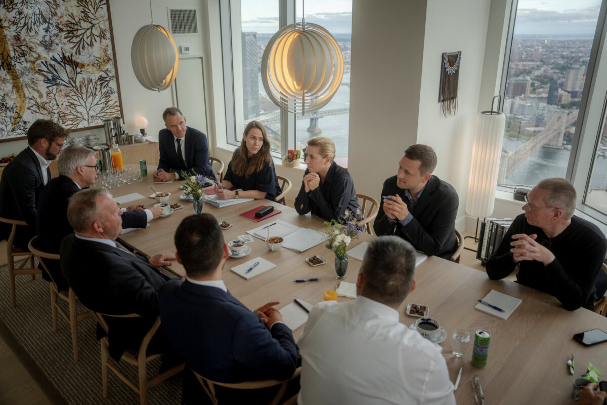 Danish Prime Minister Mette Frederiksen (far side of table, 3rd from L,) Danish Foreign Minister Lars Loekke Rasmussen (opposite her, 3rd L,) and Greenlandic Prime Minister Jens-Frederik Nielsen (far side, 2nd R,) hold a final preparatory meeting at the Danish Consul General's residence in Manhattan, New York, on Sept. 21, 2026. (Ritzau Scanpix/Mads Claus Rasmussen via Reuters)