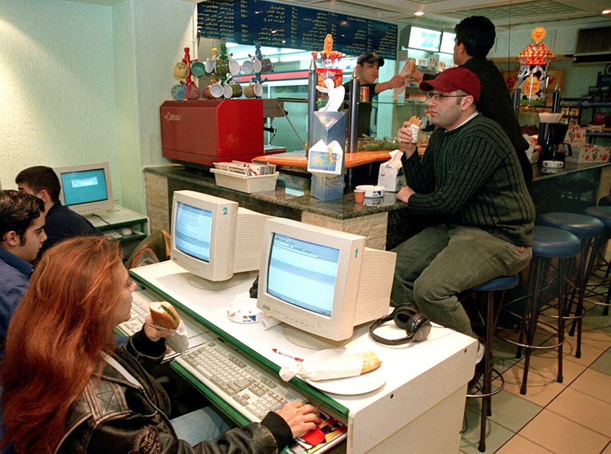 People at an internet cafe (cybercafe) in the late 1990s in a file photo. (Ousama Ayoub/AFP via Getty Images)