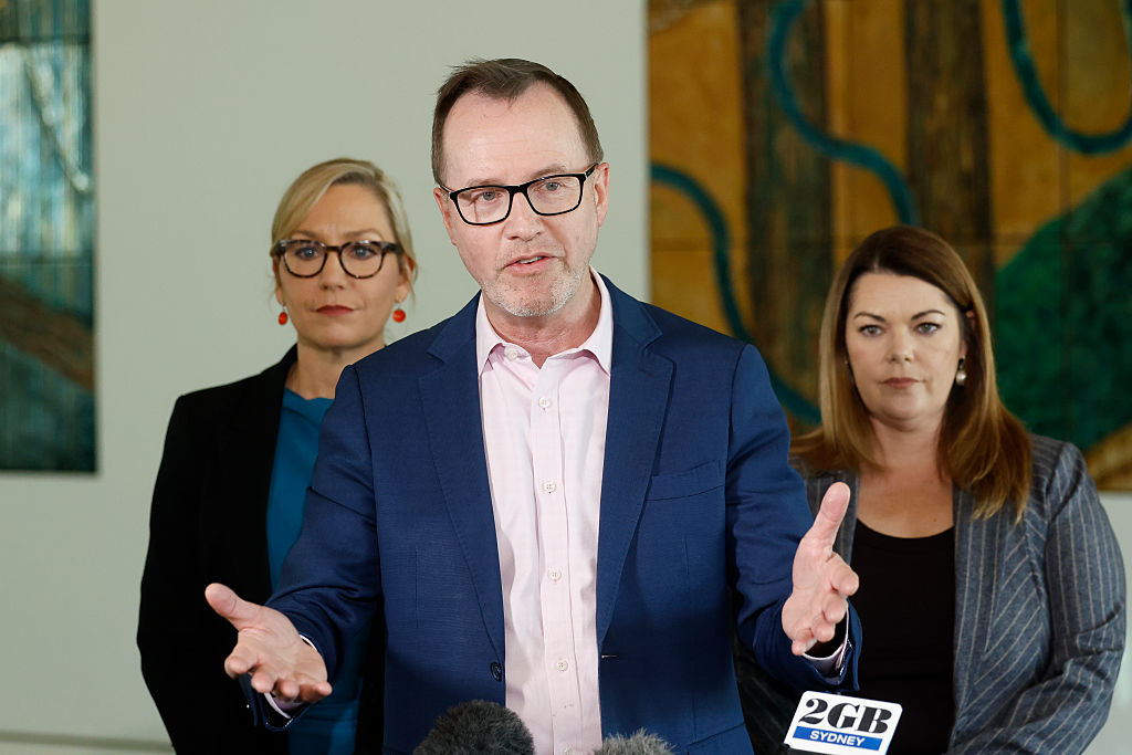 Greens Senator David Shoebridge (C) speaks to the media with outgoing Leader Larissa Waters (L) and Senator Sarah Hanson-Young (R) at Parliament House in Canberra, Australia, on Sept. 16, 2026. (Hilary Wardhaugh/Getty Images)