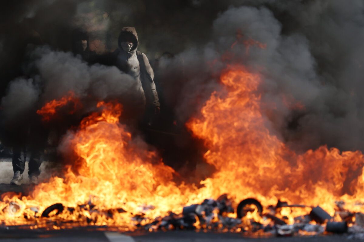 Rioters set fires as they clash with police during a march through the streets of Aubervilliers in Aubervilliers, a northern suburb of Paris, France, on Oct. 1, 2026. (Tom Nicholson/Getty Images)
