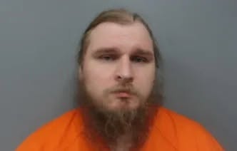 Brandon Baxter, 34, of East Cleveland, was charged with prohibitions with respect to biological weapons and possession of a biological toxin by a restricted person. (Cuyahoga County Sheriff's Department)