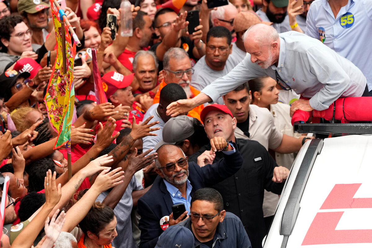 Brazilian President Luiz Inacio Lula da Silva, who is running for reelection, greets supporters during a campaign rally in Rio de Janeiro, Brazil, on Oct. 2, 2026. (AP Photo/Silvia Izquierdo)