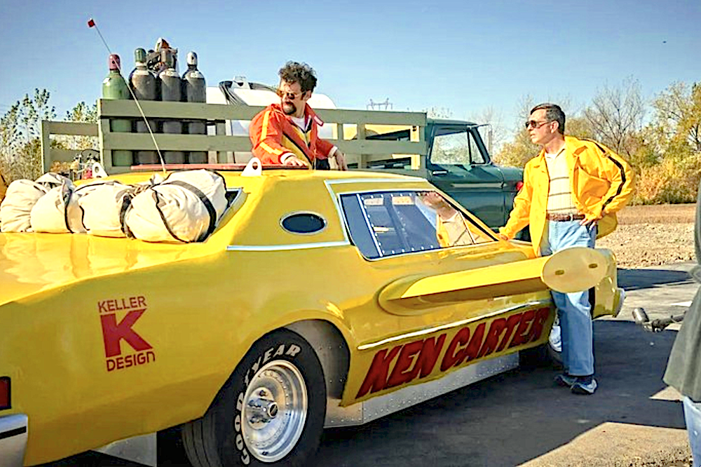 Ken Carter (Jay Baruchel, L) is the driver, and Dick Keller (Ed Helms) is the engineer of a rocket car, in "The Stunt Driver." (Cardinal Films/Mongrel Media)