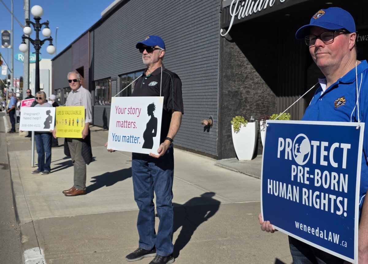Participants in this year's Life Chain pro-life rally gather in downtown Moose Jaw, Sask., on Oct. 4, 2026. (Jason G. Antonio/The Epoch Times)