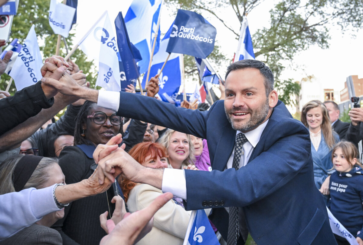 Parti Quebecois Leader Paul St-Pierre Plamondon greets supporters as he arrives for a leaders debate in Montreal on Sept. 23, 2026. (The Canadian Press/Graham Hughes)