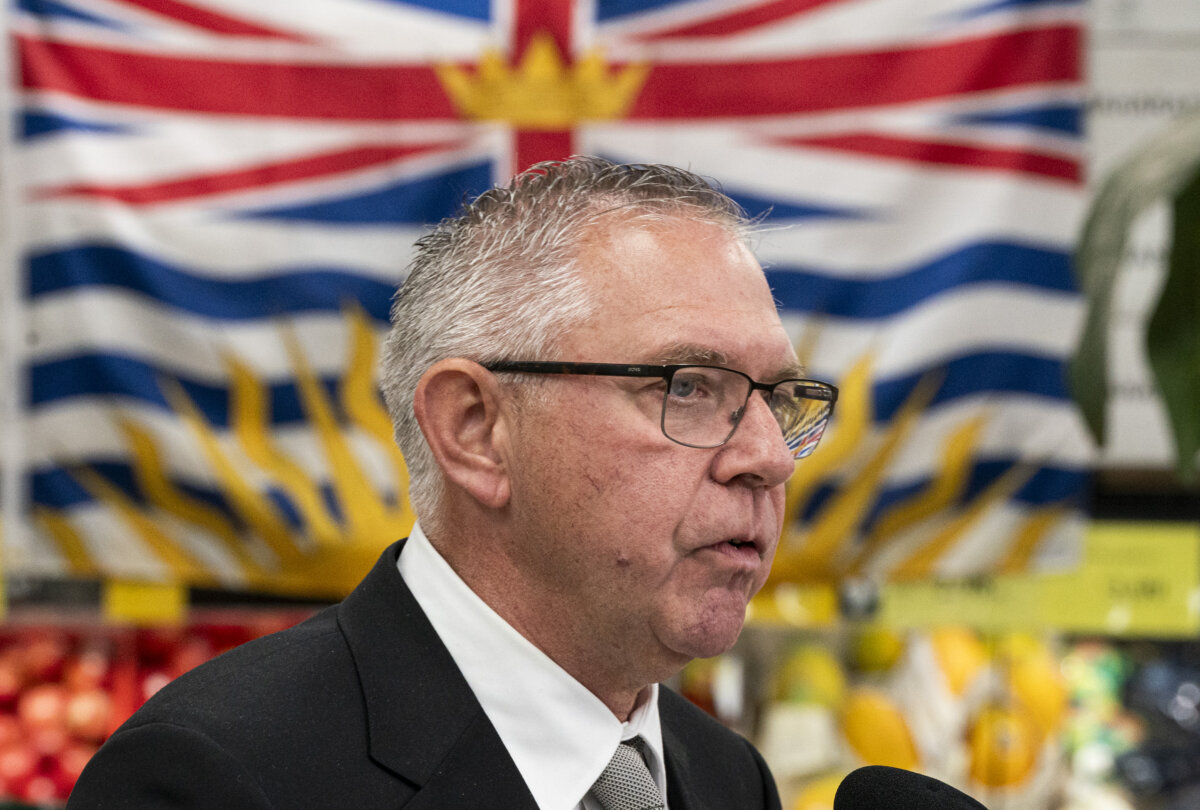 Lorne Doerkson, interim leader of the Conservative Party of British Columbia, answers questions from the media during a campaign stop at a supermarket in Surrey, B.C., on Oct. 8, 2026. (The Canadian Press/Rich Lam)