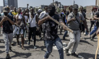 Day in Photos: Unrest in South Africa, NATO Exercise, and NYC Transit’s Annual Pop-Up Sale