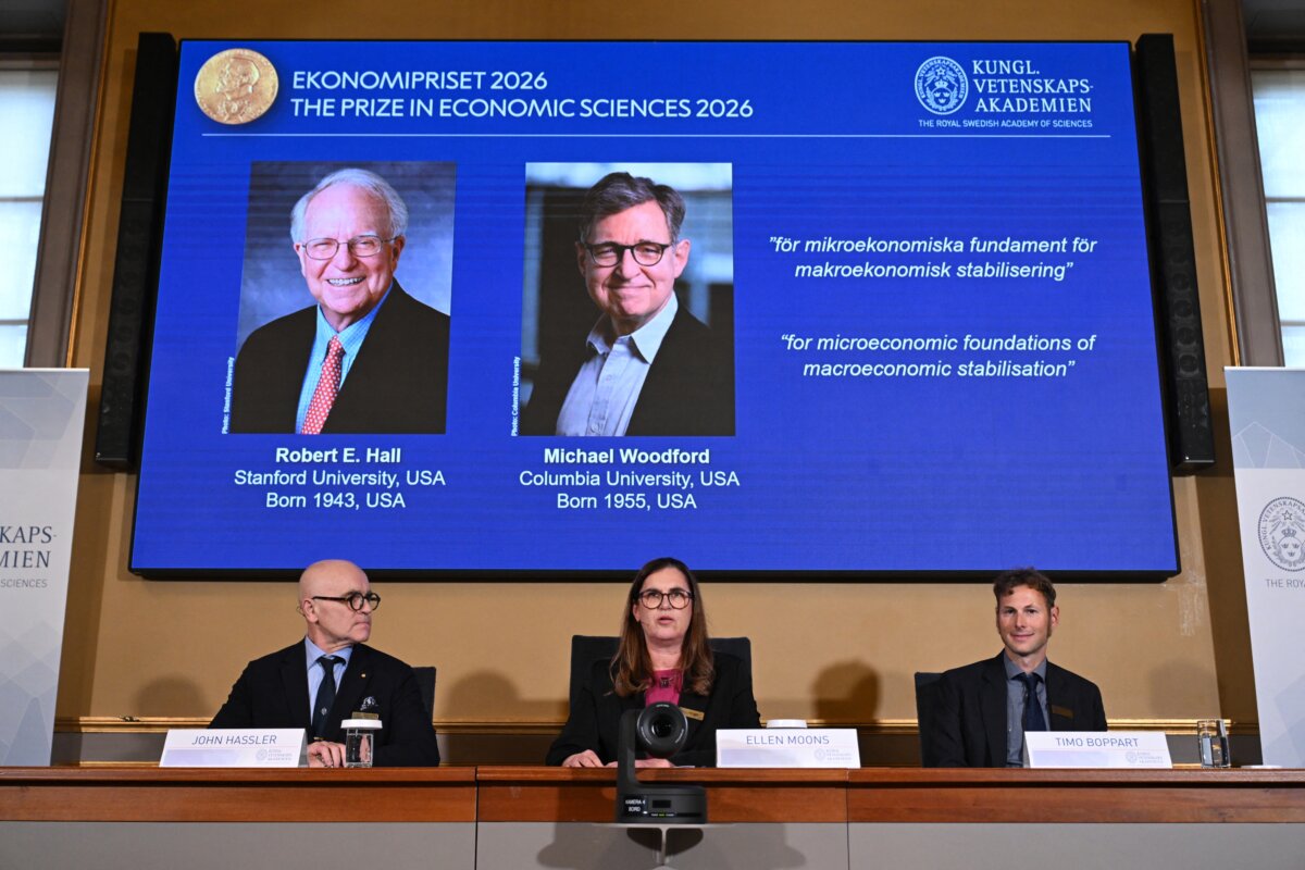 Secretary General of the Royal Swedish Academy of Sciences Ellen Moons (C), Chair of the Prize Committee John Hassler (L), and Member of the Prize Committee and expert Timo Boppart announce U.S. macroeconomists Robert E. Hall and Michael Woodford as the winners of the 2026 Sveriges Riksbank Prize in Economic Sciences in Memory of Alfred Nobel at the Royal Swedish Academy of Sciences in Stockholm on Oct. 12, 2026. (Jonathan Nackstrand/AFP via Getty Images)