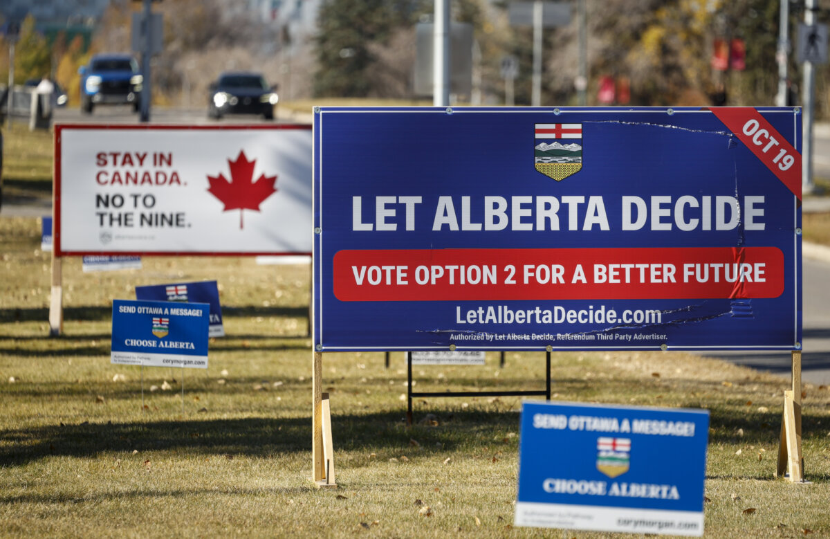 Competing referendum signs line a boulevard in Calgary, Thursday, Oct. 15, 2026. (The Canadian Press/Jeff McIntosh)