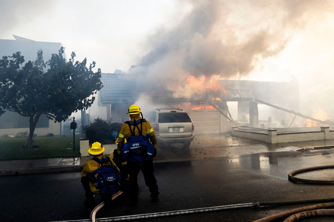 Evacuation Orders Issued as Wildfire Burns Homes in Southern California