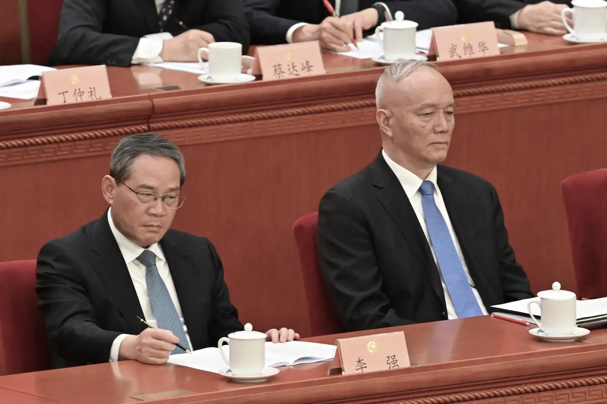 Chinese Premier Li Qiang (L) and Cai Qi, director of the Chinese Communist Party’s General Office, attend the opening session of the CCP’s National Committee of the Chinese People’s Political Consultative Conference at the Great Hall of the People in Beijing on March 4, 2025. (Adek Berry/AFP via Getty Images)