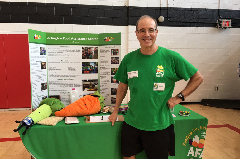 bruce horowitz standing at a booth