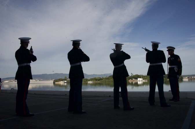 Marines fire during a Rifle Salute during a commemoration for the 75th anniversary of the Japanese attack on the naval harbor at Kilo Peir in Honolulu on Dec. 7. (Craig T. Kojima/The Star-Advertiser via AP, Pool)