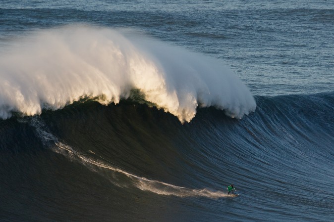 British surfer Andrew Cotton rides a big wave at Praia do Norte in Nazare, Portugal, on Dec. 17. Nazare's giant waves are increasingly attracting surfers from around the world, as it becomes part of the World Surf League Big Wave Tour. (Pablo Blazquez Dominguez/Getty Images)