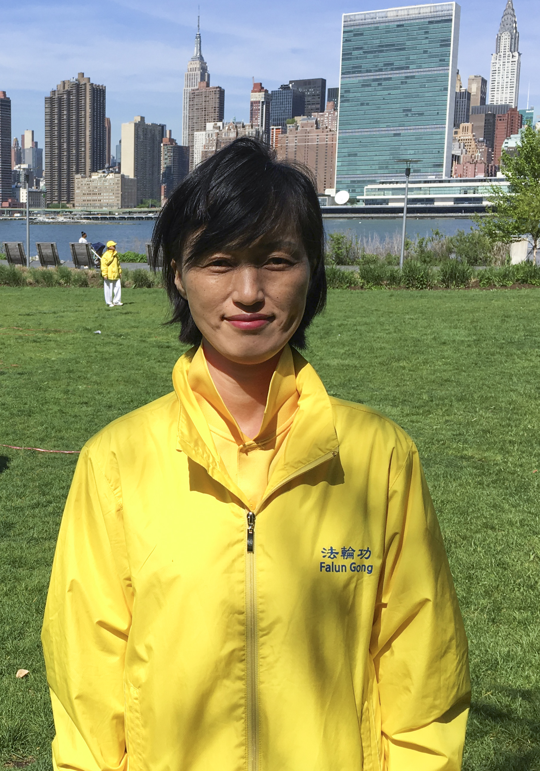 Choi Kyung-soon, a Falun Gong practitioner from South Korea, joins a character formation event at Gantry Plaza State Park on May 12, 2016. (Larry Ong/Epoch Times)