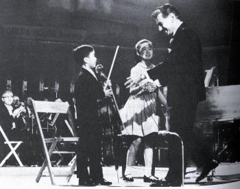 THE BIG BREAK: Yo Yo Ma (at age 7), with his sister Yeou-Cheng Ma, is congratulated by Leonard Bernstein at the Kennedy Benefit Concert in Washington, D.C., attended by President Kennedy and wife Jacqueline. (Courtesy of Marina Ma)