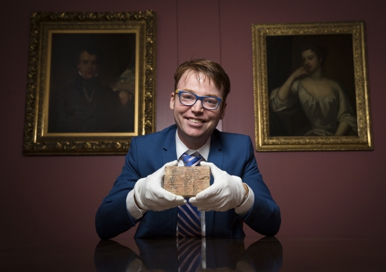 Dr Daniel Mansfield with the Plimpton 322 Babylonian clay tablet in the Rare Book and Manuscript Library at Columbia University in New York. (UNSW/Andrew Kelly)