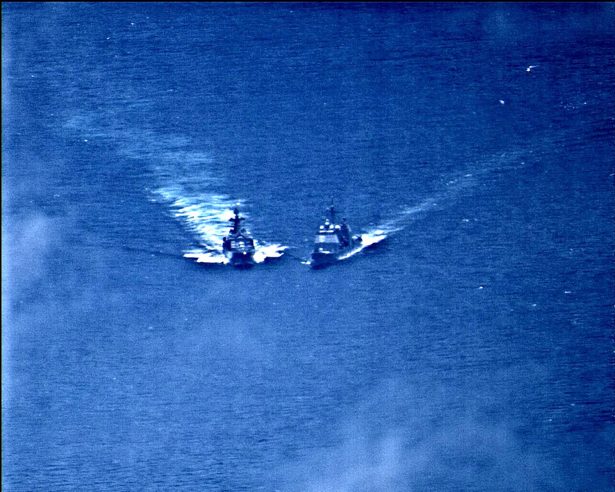 Russian naval destroyer and American warship