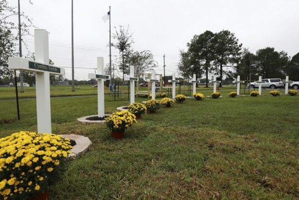 Ten crosses honoring the 10 people killed in a shooting
