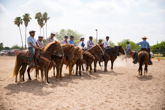 Horse patrol trainees line up for a count-off and inspection in Edinburg, Texas, on May 26. (Benjamin Chasteen/The Epoch Times)