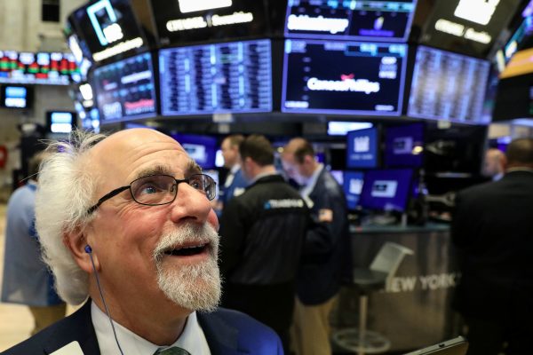 Traders work on the floor at the New York Stock Exchange