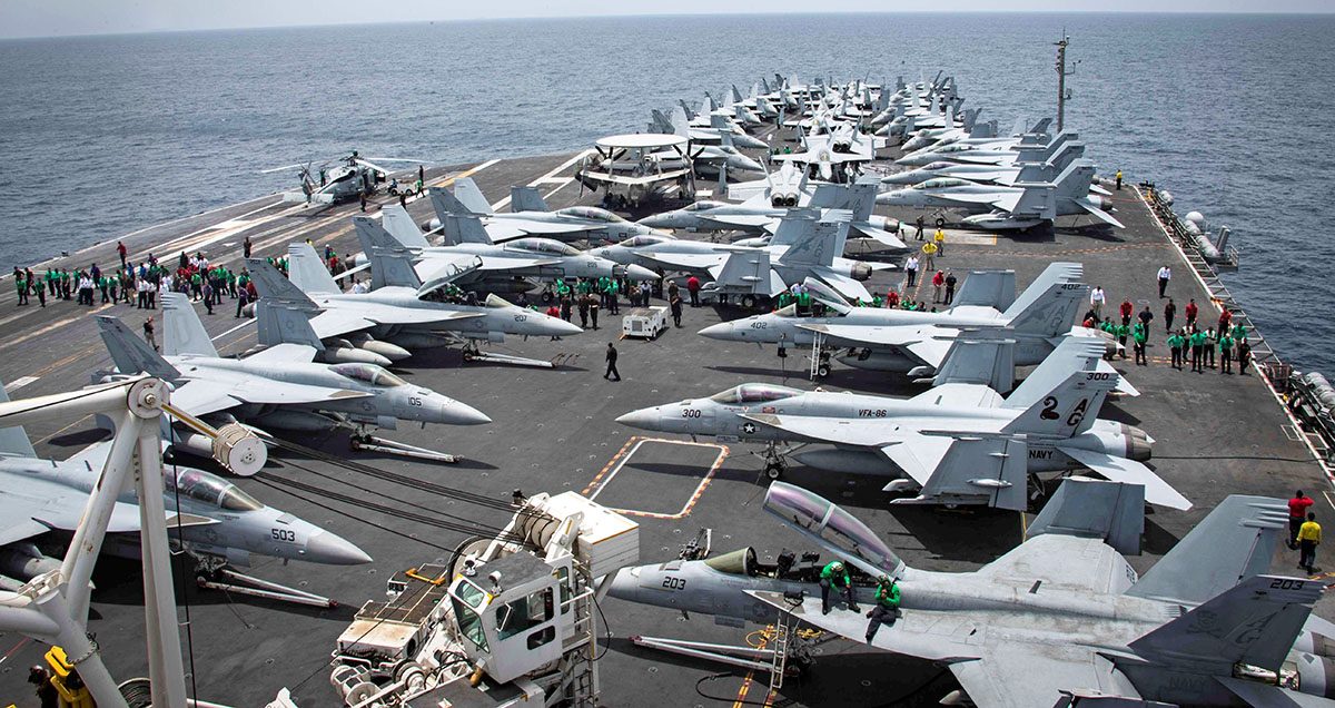 Flight deck of the U.S aircraft carrier USS Abraham Lincoln (CVN 72) is seen as sailors swip the deck for foriegn object and debris (FOD) walk-down on the flight deck of the Nimitz-class aircraft carrier USS Abraham Lincoln (CVN 72) in Arabian Sea