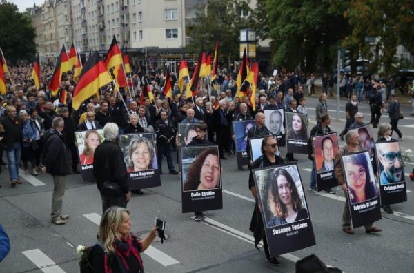 People take part in a march organized by the right-wing Alternative for Germany