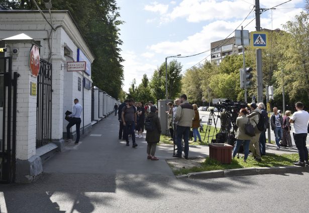 Journalists gather at a hospital