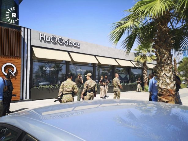 An Irbil-based Kurdish broadcaster, shows security forces at the scene of a shooting outside a restaurant in Irbil,