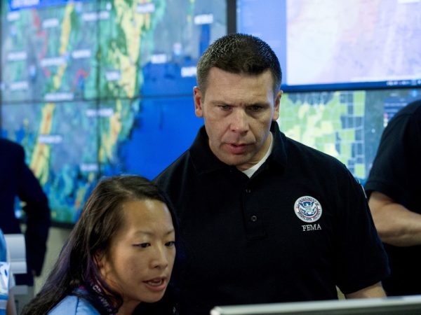 Acting Homeland Security Secretary Kevin McAleenan speaks with FEMA personnel