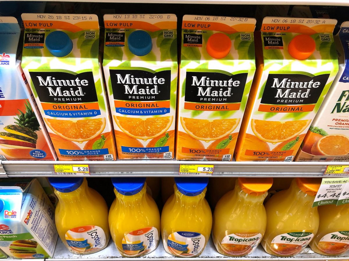 Containers of orange juice at grocery store.