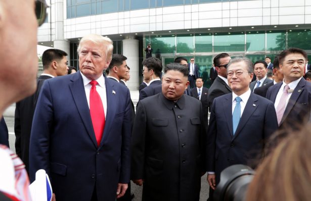 North Korean leader Kim Jong Un, U.S. President Donald Trump, and South Korean President Moon Jae-in inside the demilitarized zone