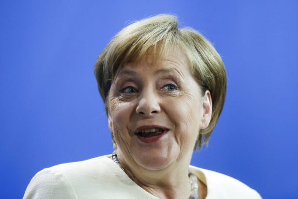 German Chancellor Angela Merkel reacts during a news conference