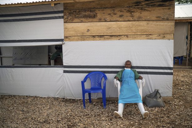 A health workers rests at the end of his shift