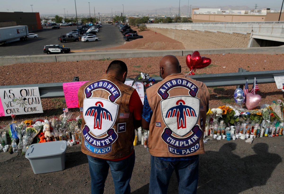 People pray a makeshift memorial