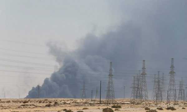 Smoke is seen following a fire at an Aramco factory
